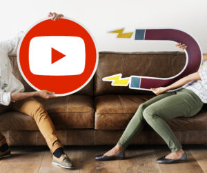 People holding coin and magnet for you tube marketing